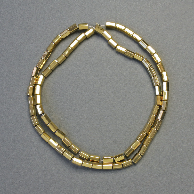 Kralen hematiet zeshoekige afgeronde hoeken, kleur lichtgoud, diameter 5×3 mm, lengte ±42 cm, streng