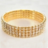 Vierrijig elastisch armband met gele strass-steentjes, omtrek 16–17 cm