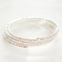 Dunne spiraalarmband met witte strass-steentjes