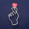 Uitverkoop! Broche «Symbool van Liefde» rood emaille, zilverkleurig metaal 25×57 mm